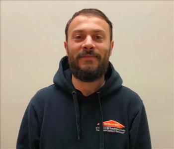 male employee in a SERVPRO hoodie